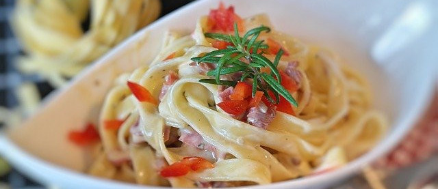 Creamy chicken stroganoffserved in a white dish.